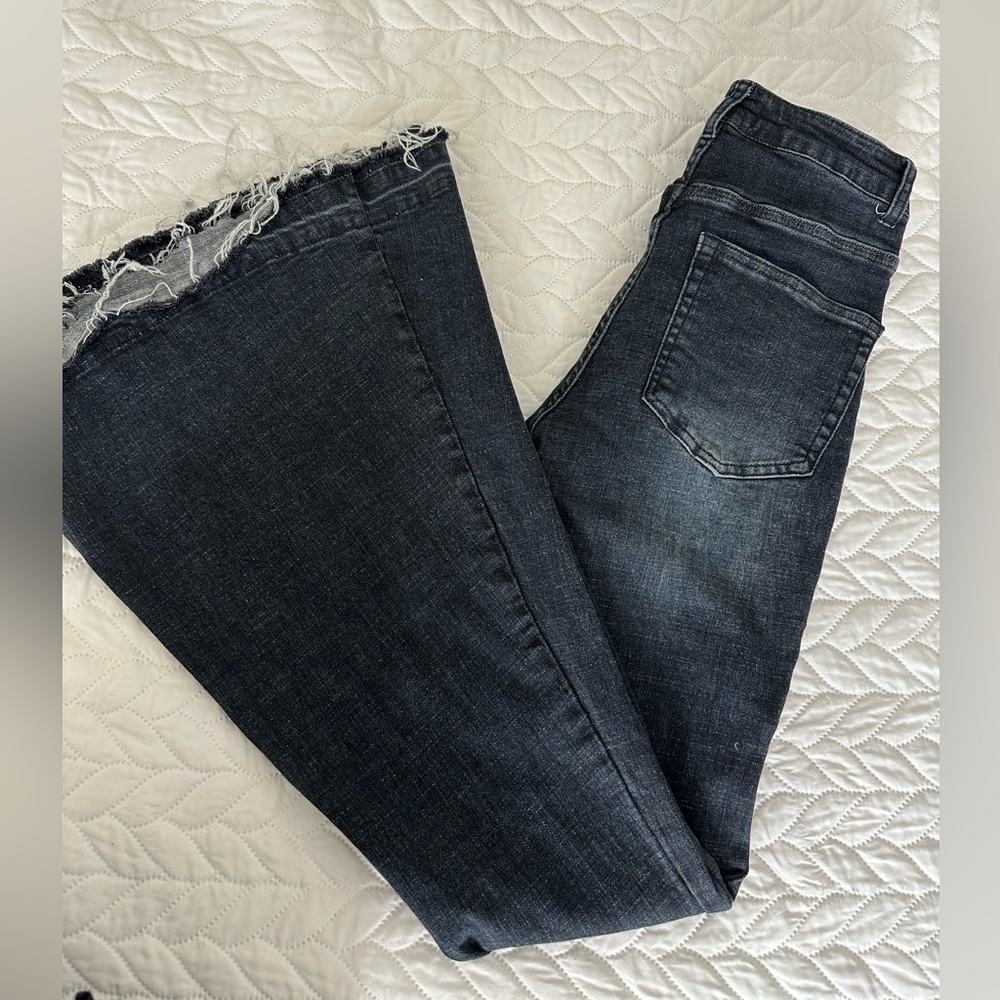 Dark wash stretchy flare bell bottoms from Altar'd State in size XS